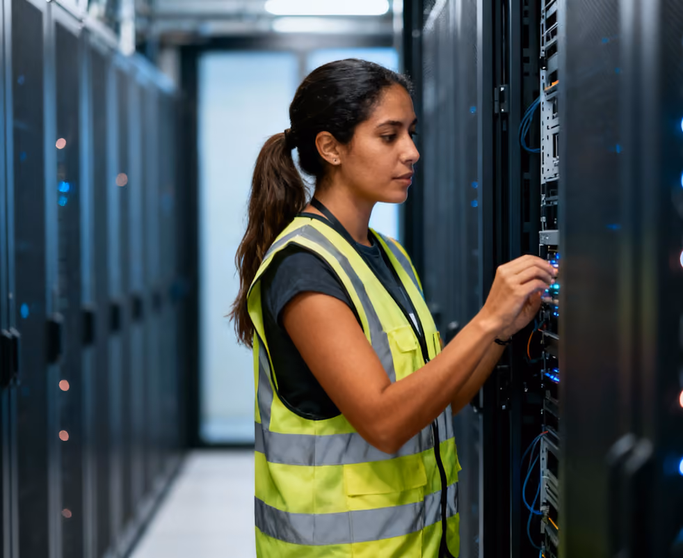 Technician working in a server room