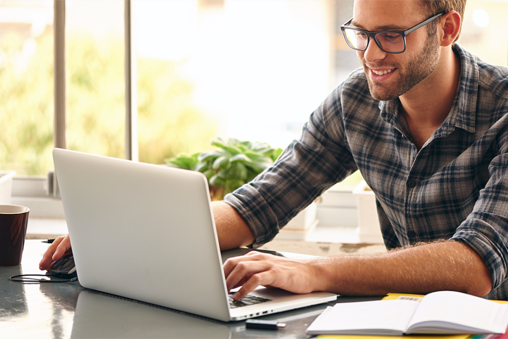 Young man working at his laptop